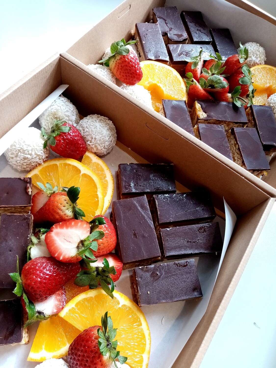 RAW TREAT BOX for 5 people. Mix of raw Apricot-dark chocolate slice, raw caramelly nut slice and lemon bliss balls with fresh fruit and berries* GF, DF This requires 2 days notice please.