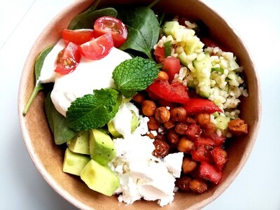 TABOULEH BOWL. Spiced and roasted chickpeas and capsicum with bulgur wheat tabouleh with cucumber, cherry tomato, avocado, feta, herbed yoghurt sauce and salad greens. 500ml bowl.