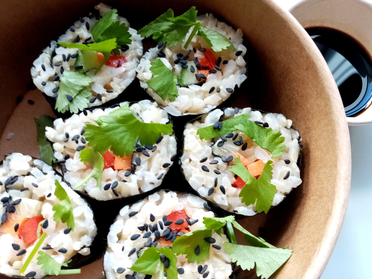 BROWN RICE  SUSHI. brown rice sushi with baked tofu, capsicum, cucumber, carrot, pickled ginger and sesame seeds. Gluten free soy sauce or sweet chillie.  GF,DF, V