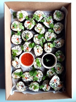 SUSHI BOX. 30 pcs Brown rice Sushi filled with cucumber, carrot, capsicum, baked organic tofu. With sesame seeds, coriander, soy sauce and sweet chillie sauce.