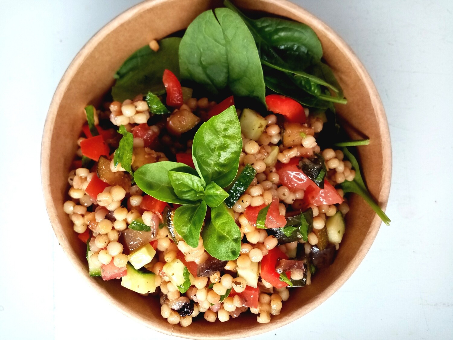 COUSCOUS. Israeli couscous salad with fresh herbs, lemon juice, olive