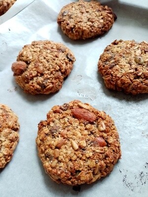 NOURISH COOKIE oats, nuts, seeds, cranberry and cacao nibs cookie sweetened with maple syrup.