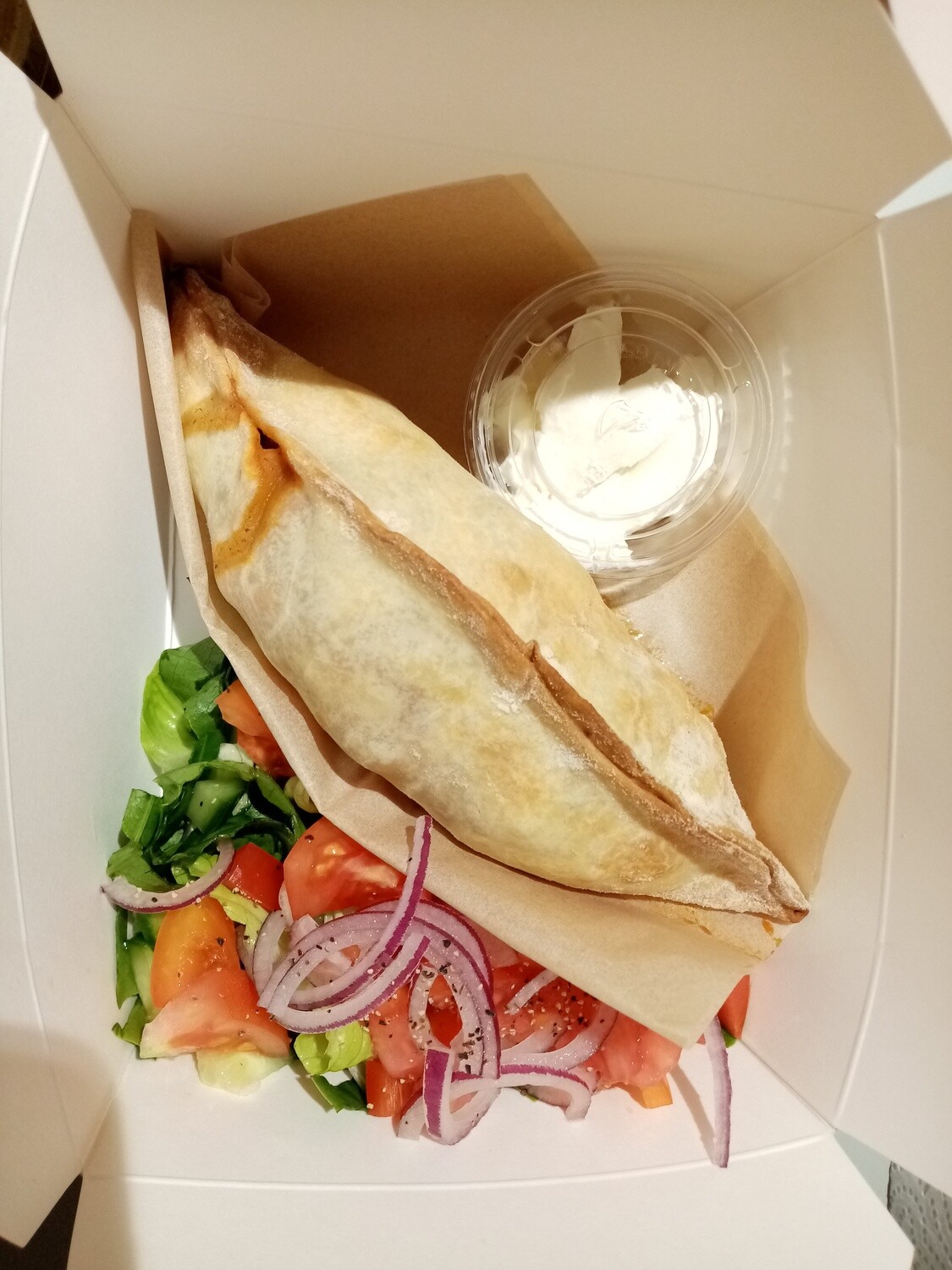 EMPANADA. Freshly baked, homemade pastry filled with mildly spiced prime beef mince, kidney bean, corn and capsicum. On baby spinach with sour cream. Optional side salad.