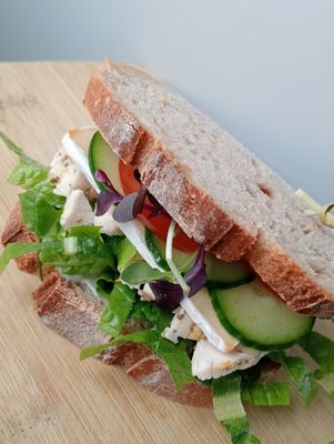 MONDAY SAMMY: freshly baked Ciabatta pocket or our sourdough rye bread filled with salad greens, tomato, cucumber and your choice pickles, spread and filling.