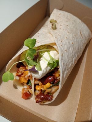 MEXI WRAP brown rice salad with corn, kidney beans, red onion, capsicum, baby spinach, coriander, mexican spices, guacamole, sour cream and edam. You can toast this in a sandwich press too!