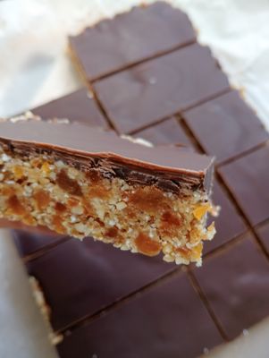 RAW APRICOT SLICE with coconut, cashew, almonds, lemon, honey and dark chocolate. GF