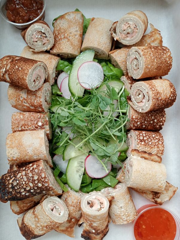 24x mini buckwheat crepe rolls filled with hot smoked salmon and a cream cheese-feta-herb spread. GF