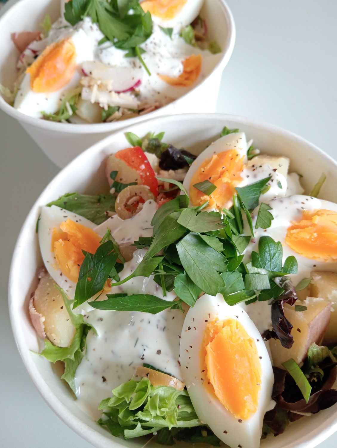SPUD BOWL roasted potato salad with cos, capsicum, apple, radish, red onion, corn, gherkins and a boiled free range egg. Dill-white wine vinegar- olive- honey-cumin vinaigrette.
