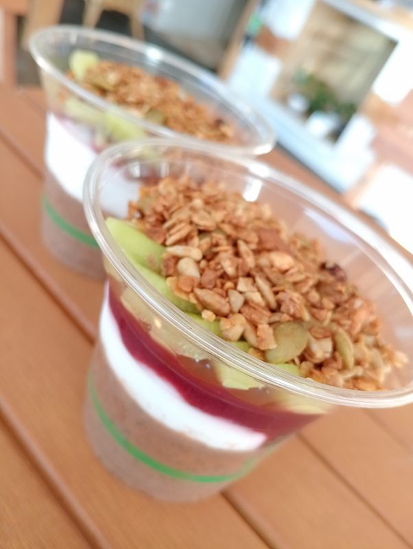 CHIA CUP. raw cacao chia pudding with coconut Greek yogurt, berry compote and granola. Df