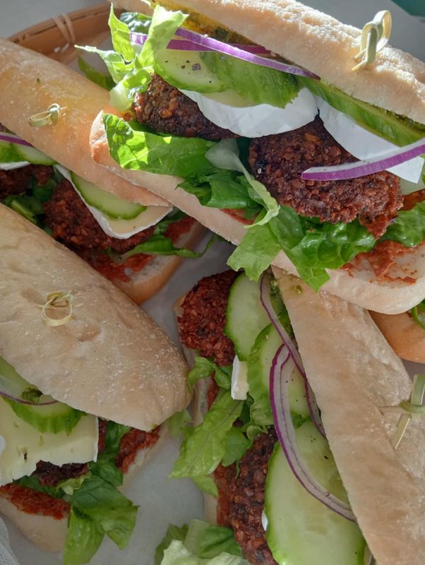 DESIGN YOUR SAMMY: freshly baked Ciabatta pocket filled with salad greens, tomato*, cucumber* and your choice pickles, spread and filling.