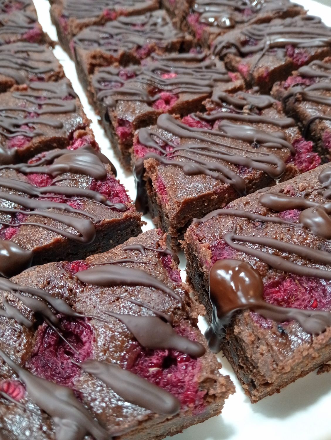 Whittakers dark Ghana, almond and raspberry brownie slice . GF