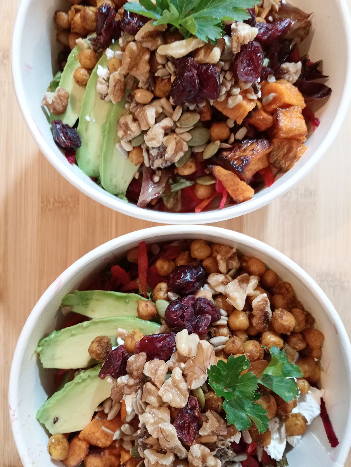 MINT BOWL Colorful raw salad with honey-curry roasted chickpeas, roasted kumara, feta, avo*, salad greens, toasted seeds, walnuts, dried cranberries and apple cider -lemon -honey -mustard vinaigrette.