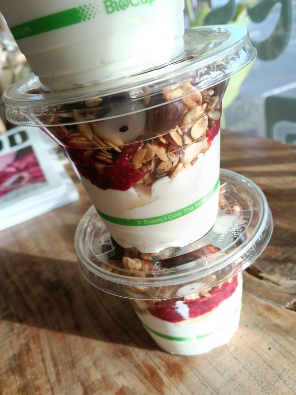 GRANOLA CUP with vanilla bean coconut yoghurt, raspberry-chia-compote and fresh seasonal fruit. DF