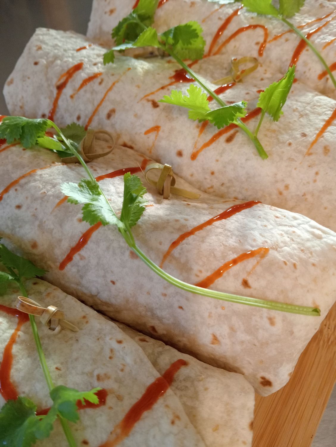 VEGE BURRITO. Tortilla filled with black bean salsa, avocado, sour cream, grated edam, spinach and roasted vegetables. Suitable for toasting in the sandwich press.