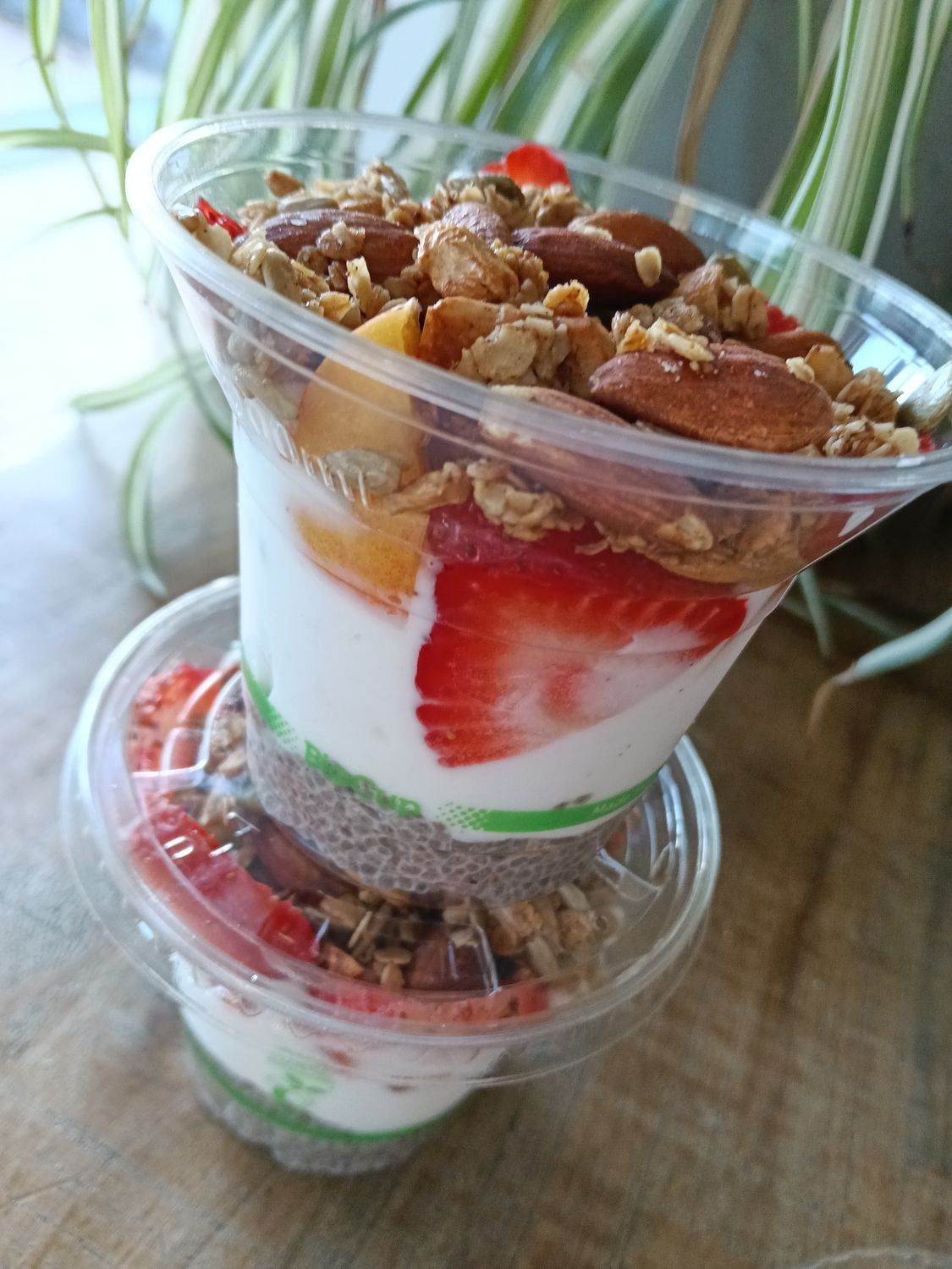 GRANOLA CUP with vanilla chia pudding, coconut yoghurt, seasonal fruit and homemade oaty granola. DF