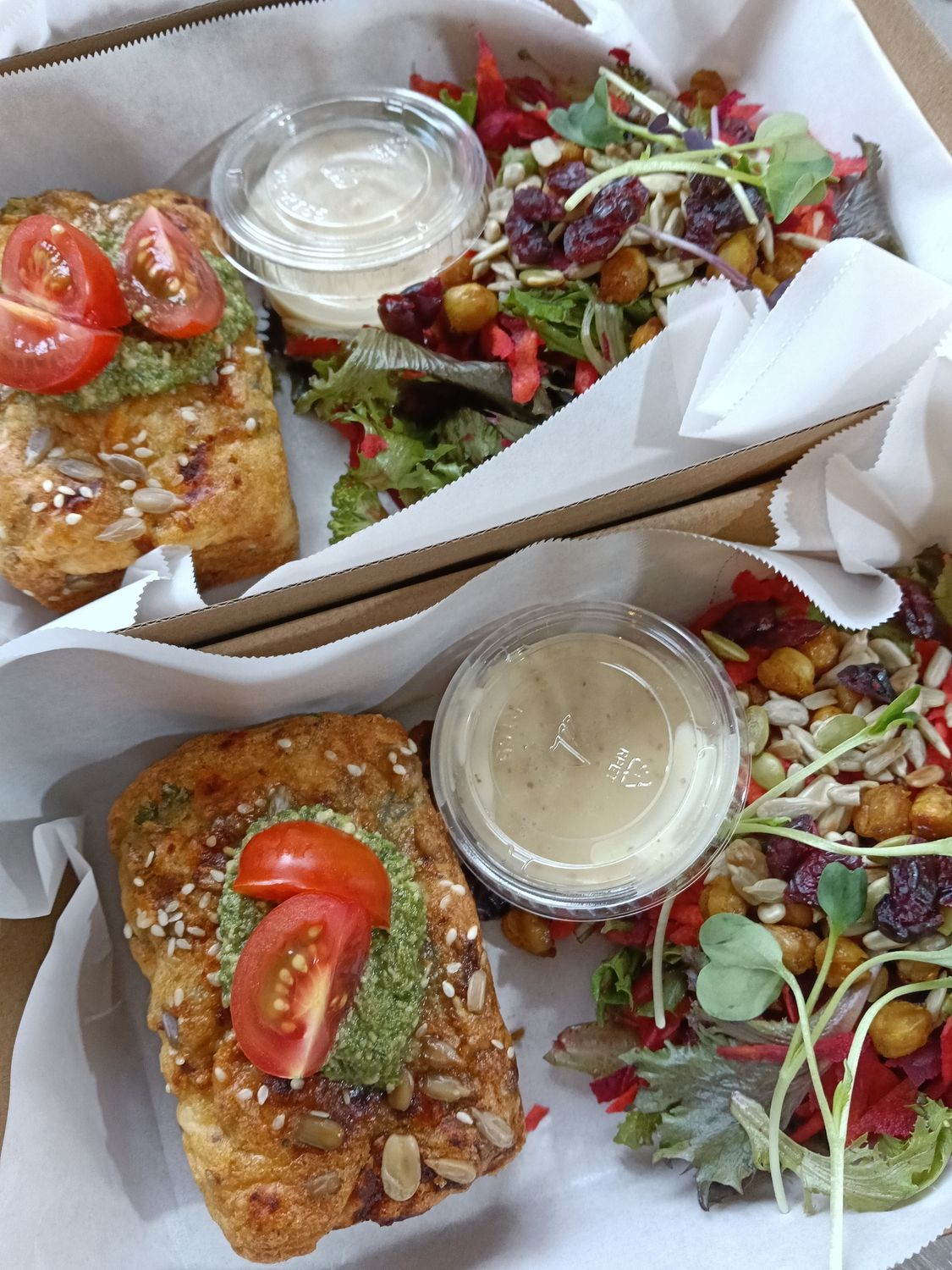 VEGETABLE LOAF. Seasonal vegetable, parmesan, seed and herb, wheat free mini loaf topped with pesto and a rainbow salad on the side.