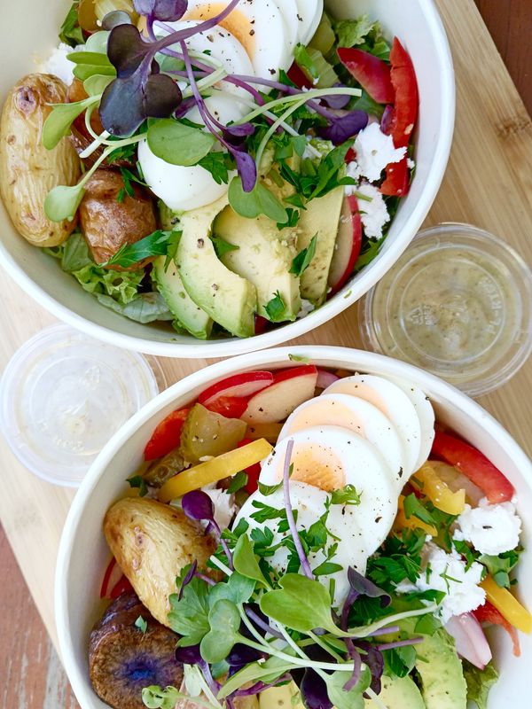 SALAD BOWLS OF THE DAY - DELIVERED FOR YOUR TEAM. Our nourishing salad creation of the day with vinaigrette and your choice protein. Contact us if you'd like a specific salad.
