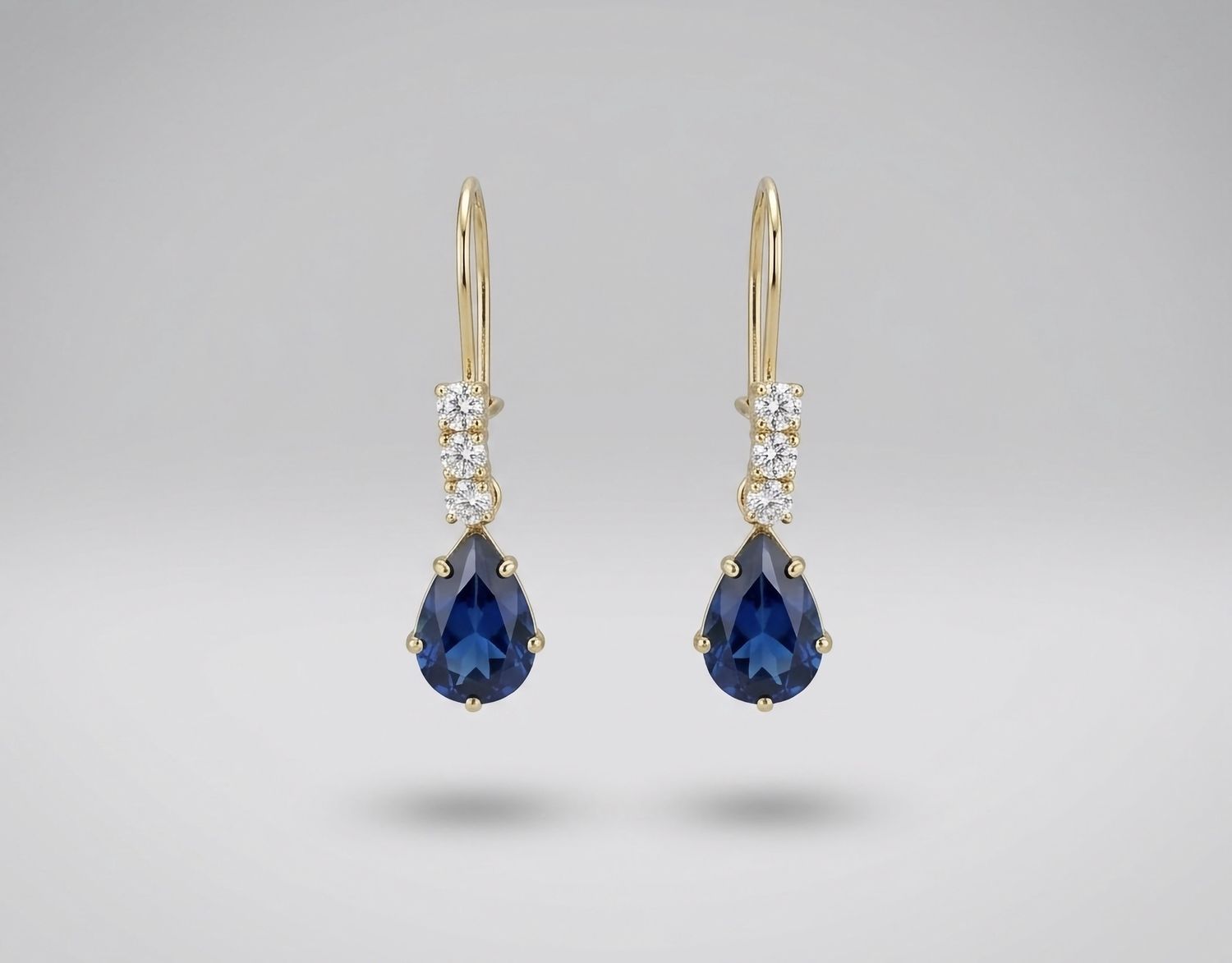 14kt Gold 3 Stone Pear Shape Earrings (Blue Topaz)