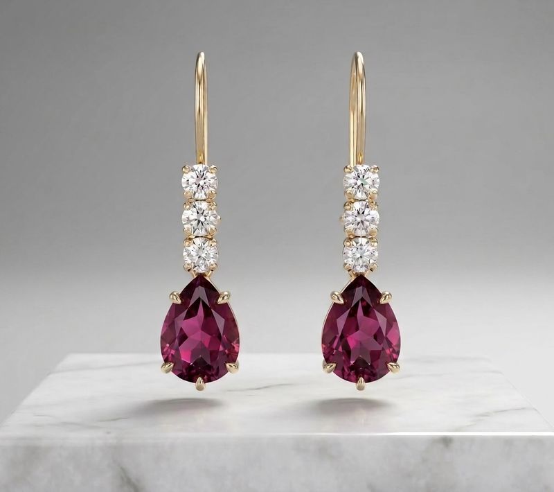 14kt 3 Stone Pear Shape Earrings (Ruby)
