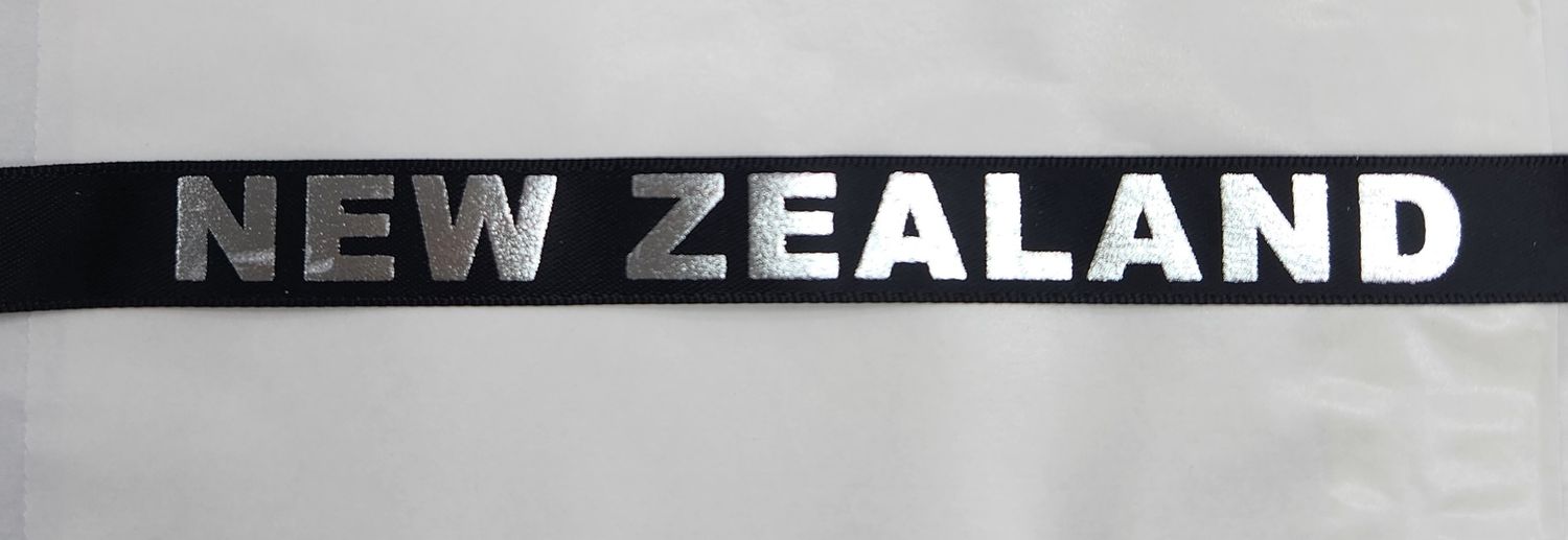 Metallic Silver NEW ZEALAND on Black Ribbon 16mm Width, Price per metre
