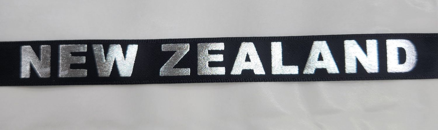 Metallic Silver NEW ZEALAND on Black Ribbon 25mm Width, Price per metre