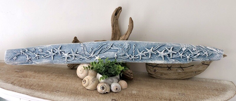 Driftwood embellished with clay