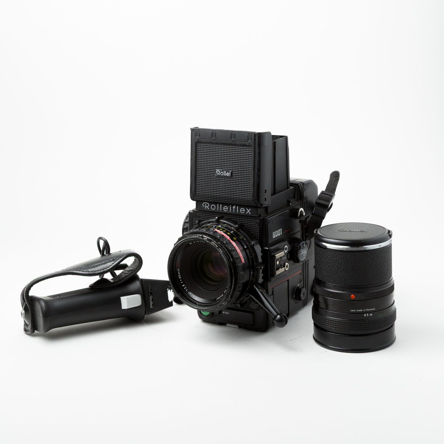 Rollei 6001 w/80mm f/2.8, 50mm f/4 lenses, spare battery, spare magazine, and pistol grip