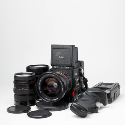 Rollei 6001 w/50mm f/2.8, 150mm f/4, 50mm f/4 lenses, polaroid back, and 2 standard backs