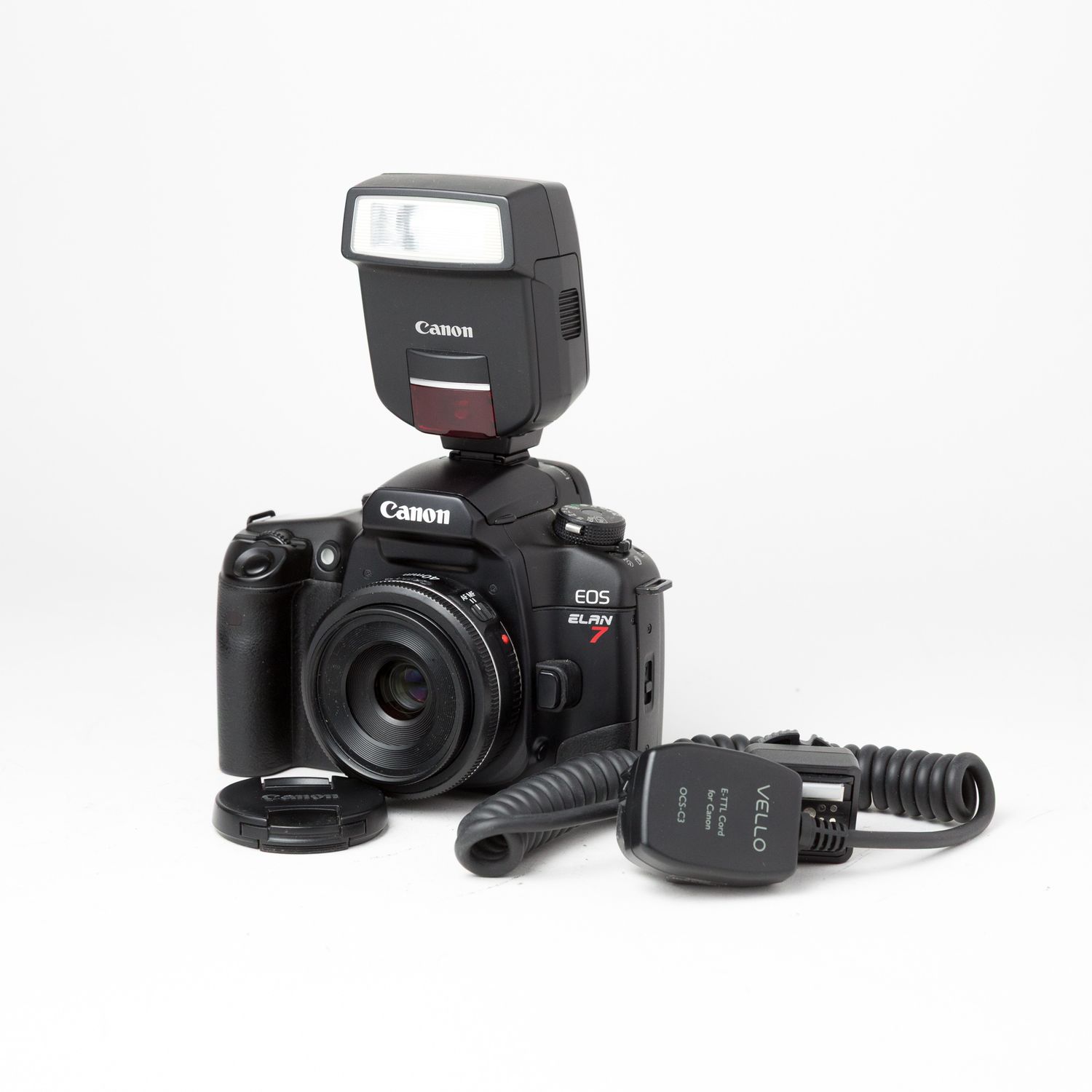 Canon Elan 7 w/ Canon 40mm f/2.8 pancake lens, flash cord, and Canon speedlite 220EX flash