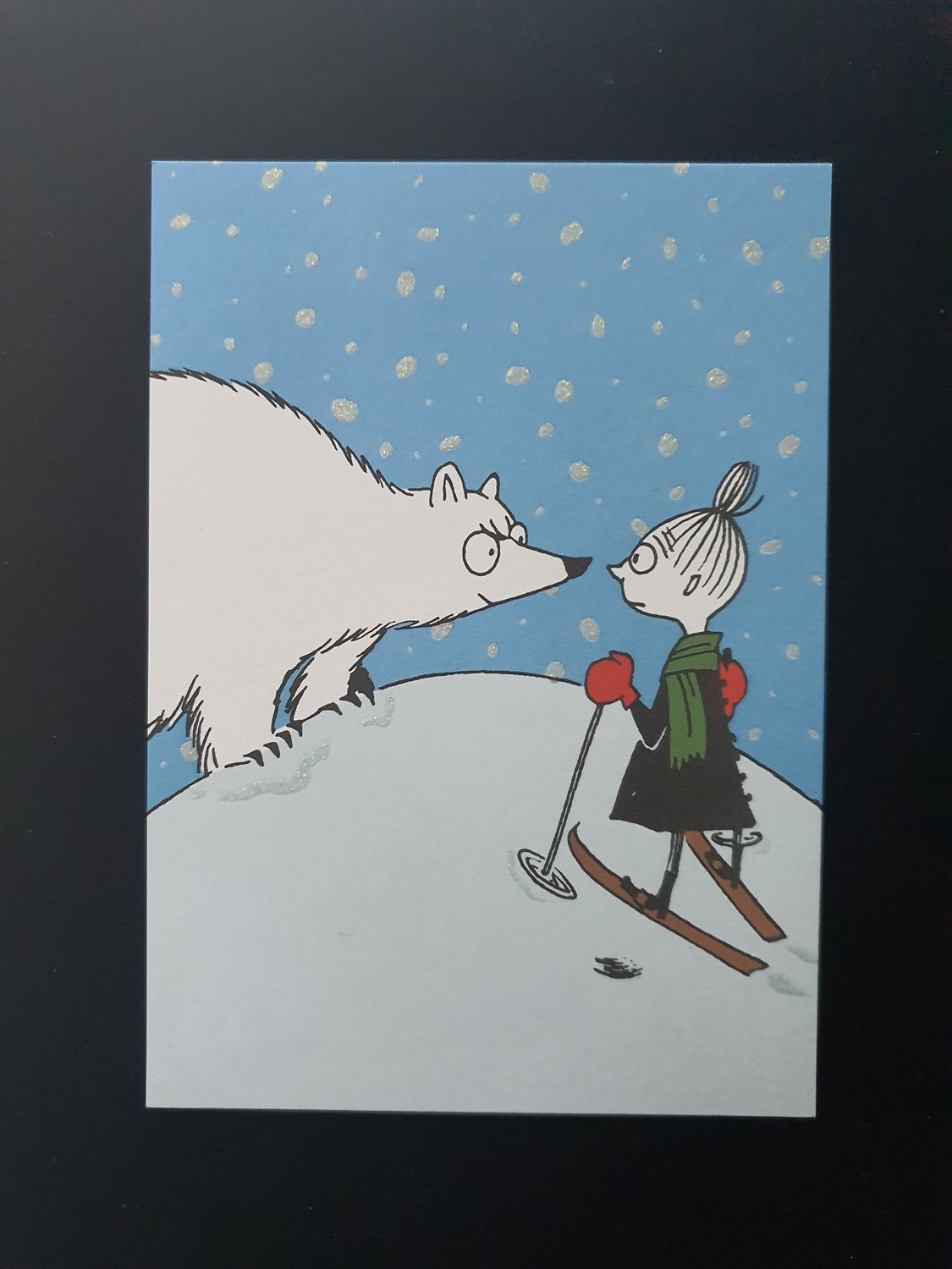Pocztówka Mimbla na nartach.