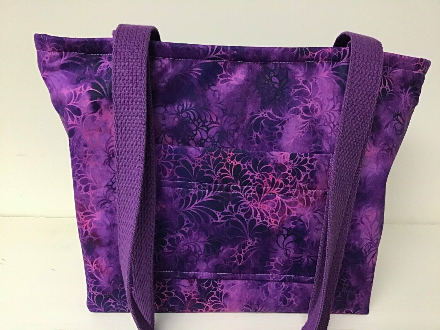 Geometric print in vivid purple and violet, purple straps