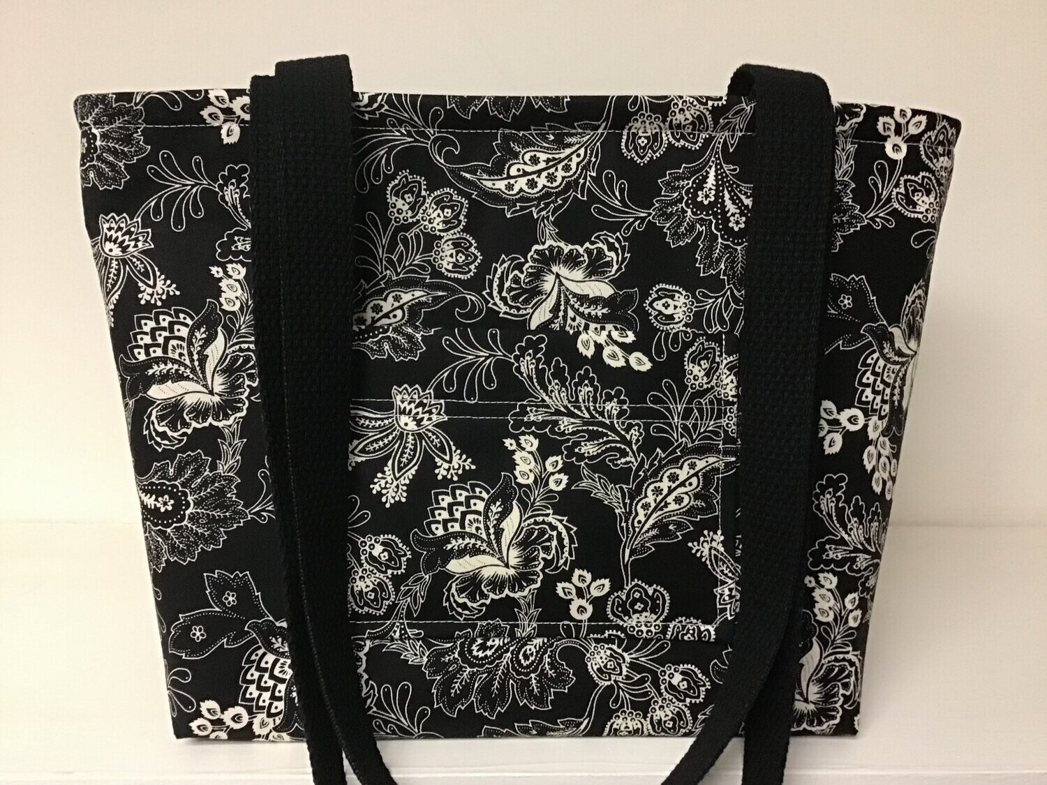 Paisley-ish print in ivory and black, black straps
