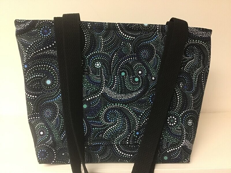 Geometric swirling dots in greens & teal on black, black straps