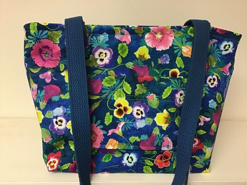 Bright pansies and garden flowers on medium blue, medium blue straps