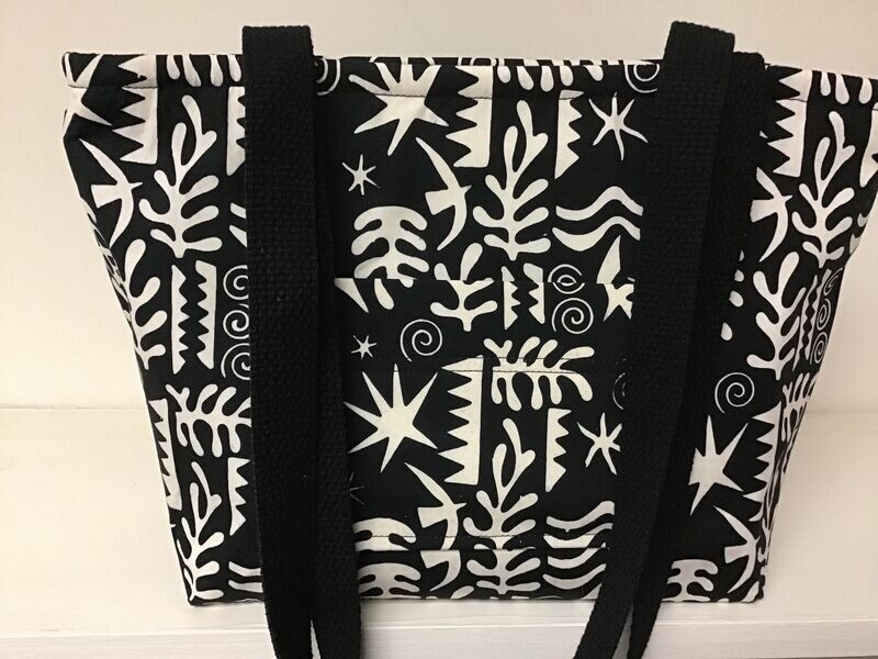 Aztec-ish print in jet black and ivory, black straps