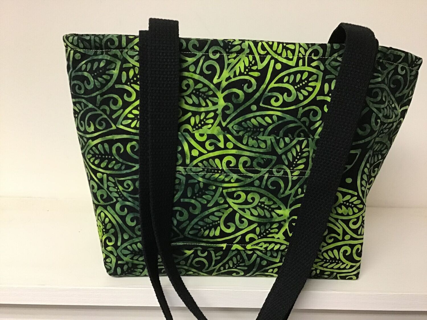Lime green shades on black in this leafy paisley batik print, back straps