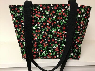 Tiny strawberries with leaves and flowers on black, black straps