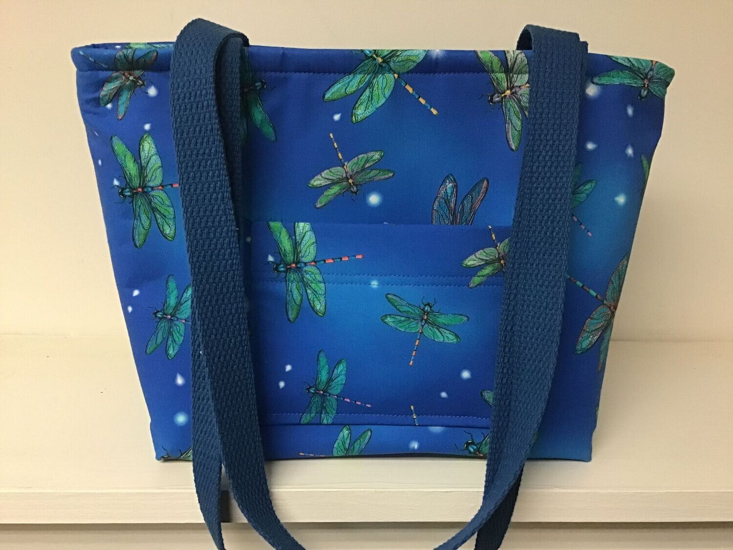 Mostly green dragonflies on royal blue, royal blue straps