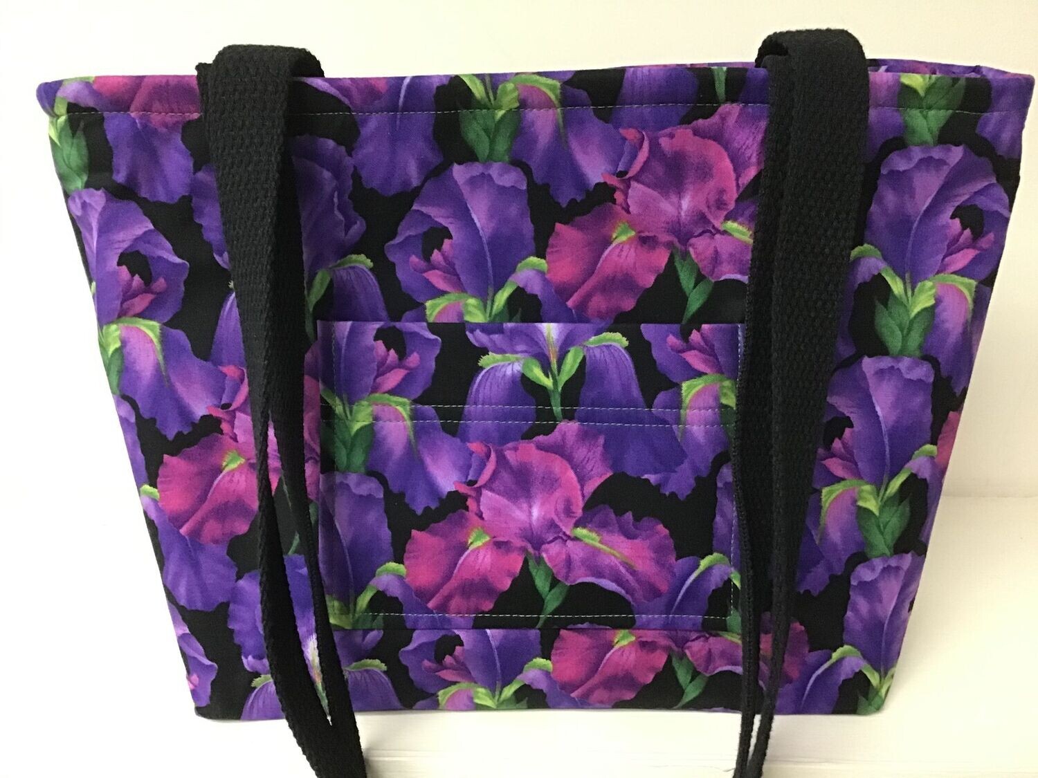 Purple and magenta irises on black, black straps