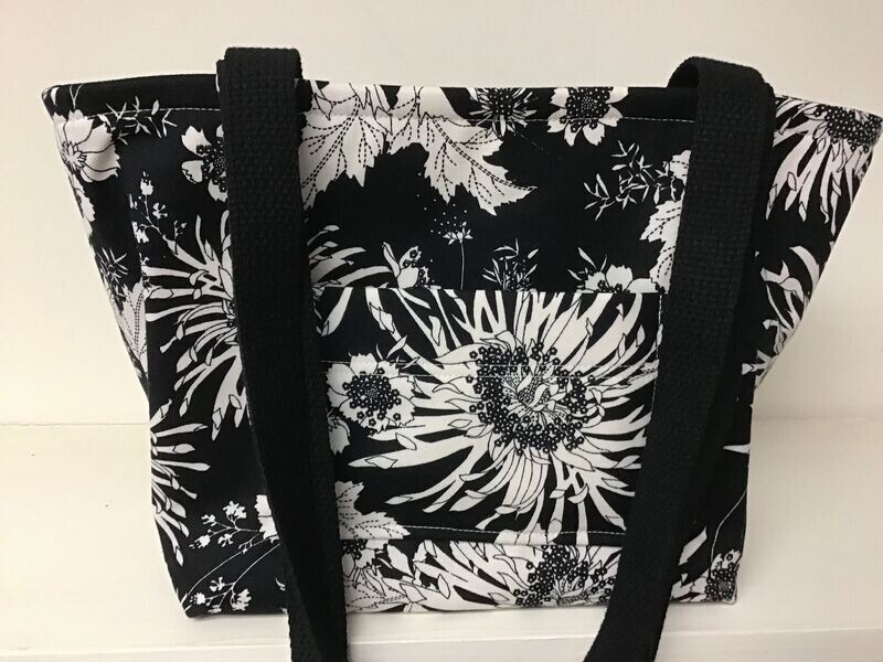 Exotic ivory flowers on black, black straps