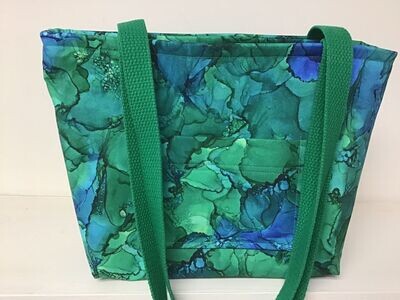 Mostly green, some blue sea glass (under water?), green straps