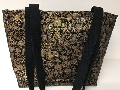 Small floral print in gold on black, black straps
