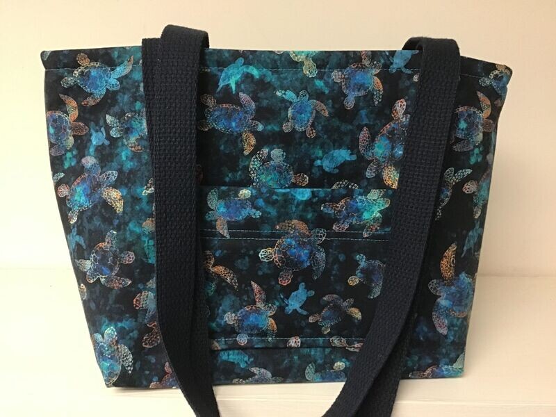 Batik turtles in teal and gold on a deep blue sea, deep blue straps