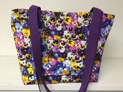 Pansies in many colors, but mostly purple, purple straps