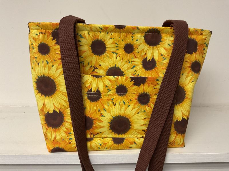 Bright sunflowers with brown centers, brown straps