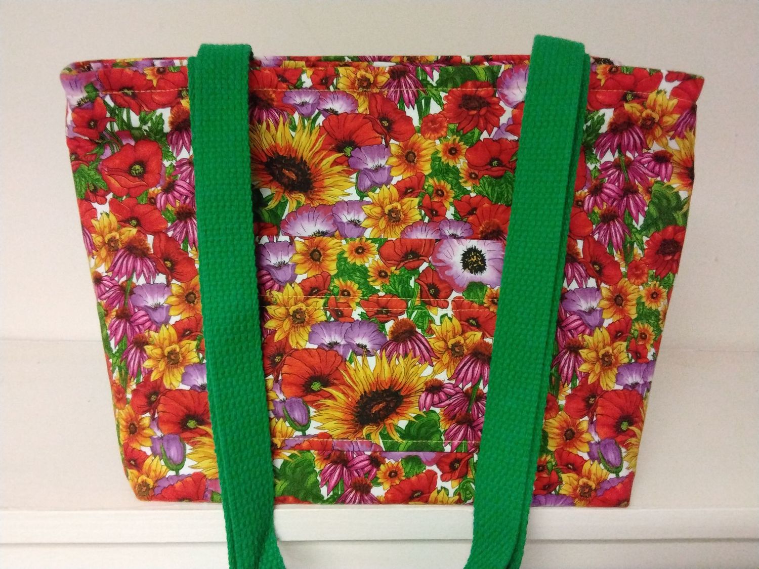 Bright floral in yellow, orange & green, green straps