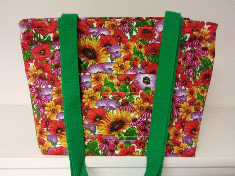 Bright floral in yellow, orange & green, green straps
