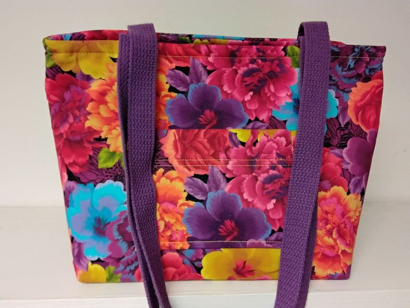 Bright multicolored garden flowers, purple straps Bright multicolored garden flowers, purple straps