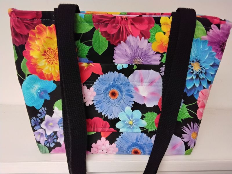 Large garden flowers on black, black straps