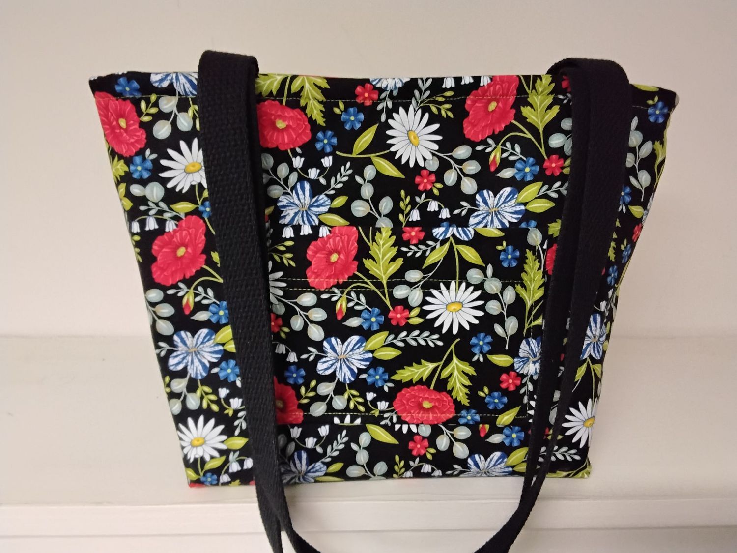Bright and happy poppies and daisies on black, black straps
